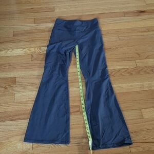 Under Armour purple flared leggings